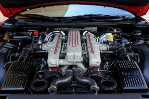 Car with the hood up to show the engine