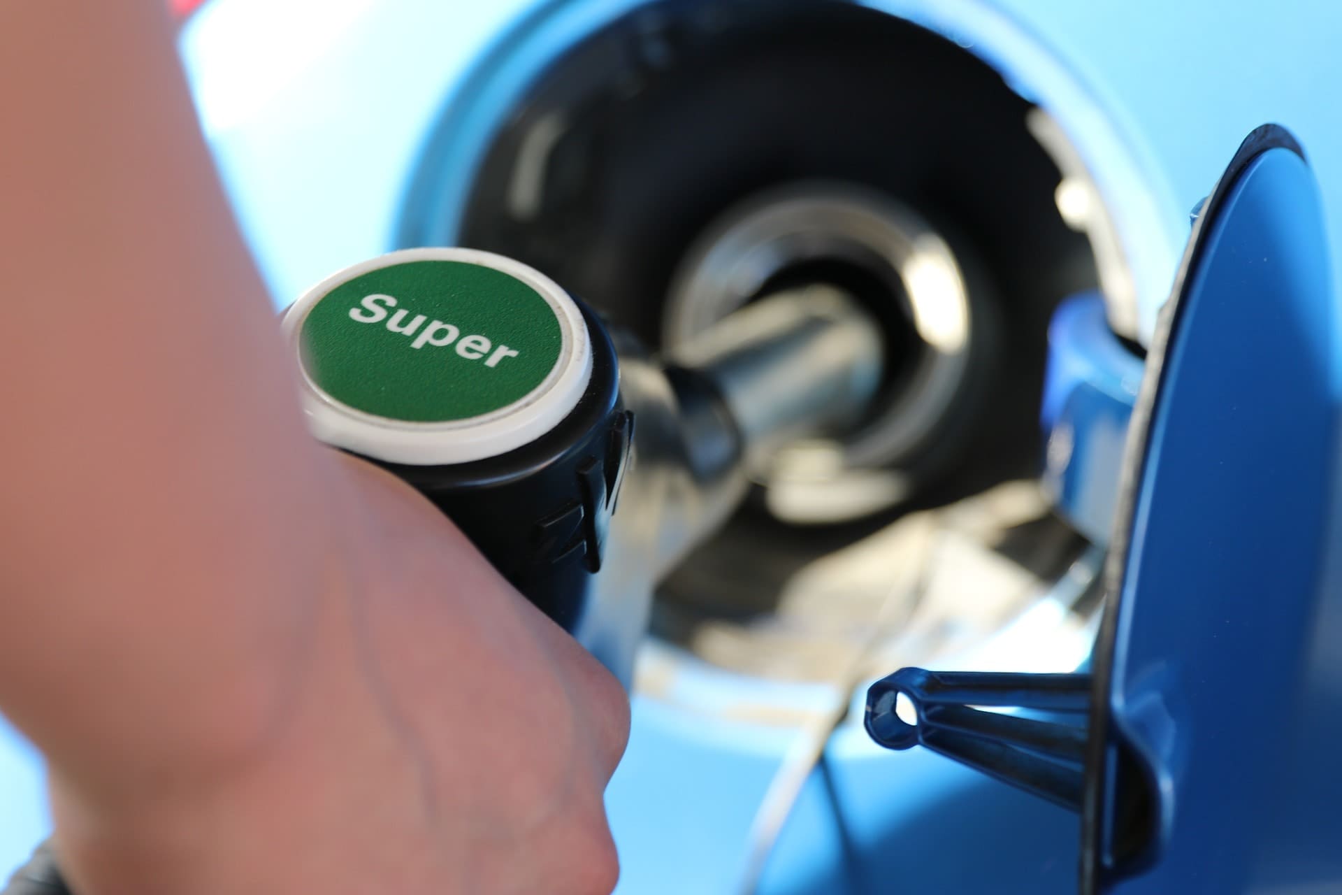 Gas pump handle with the word "Super" on it.