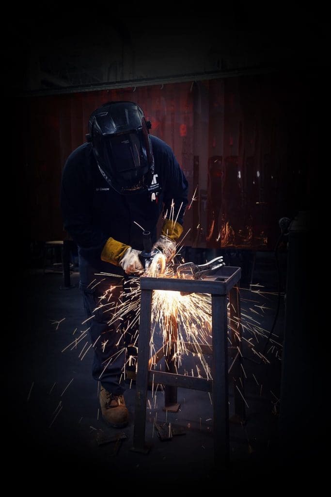 A Tidewater Tech Combination Welding student using an angle grinder.