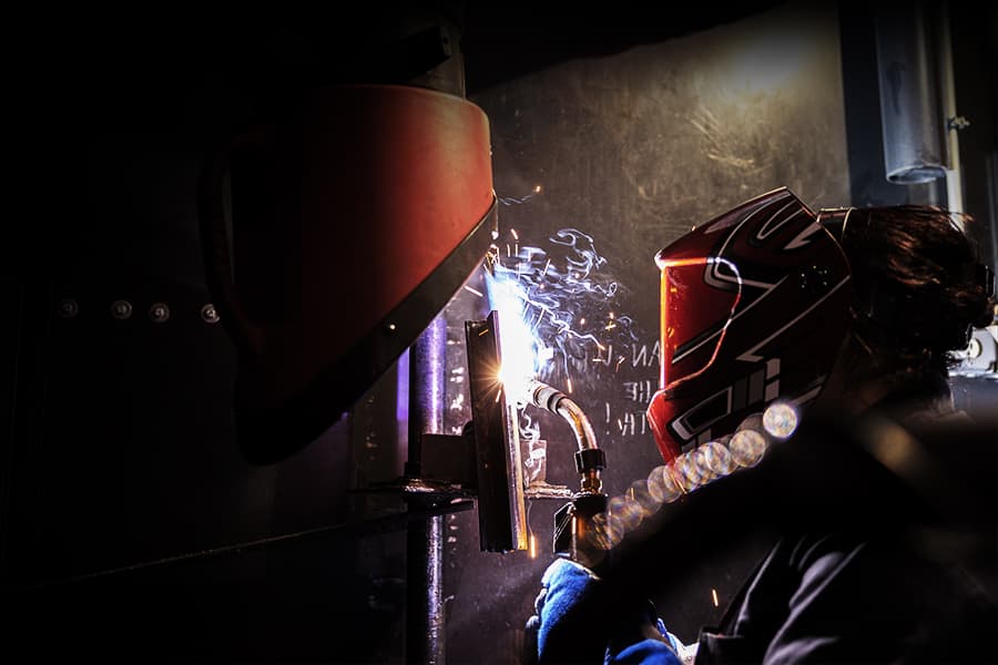 A Tidewater Tech student welding in the lab.