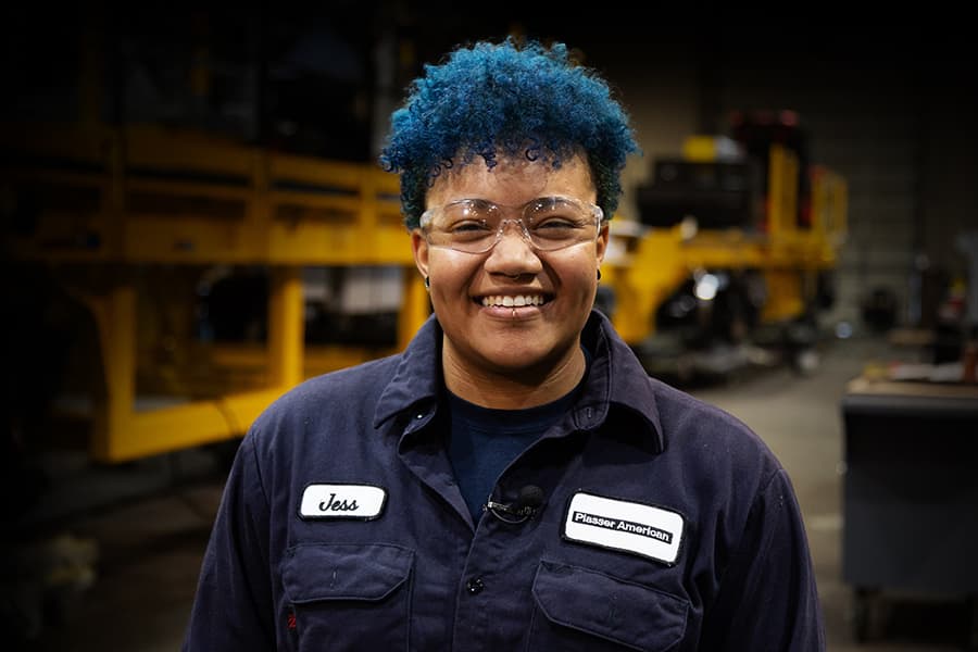 Photo of Jessica Yarber, Tidewater Tech graduate and welder for Plasser American, working in their machine shop.