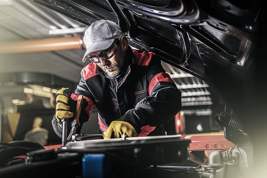 Automotive Technician repairing a car