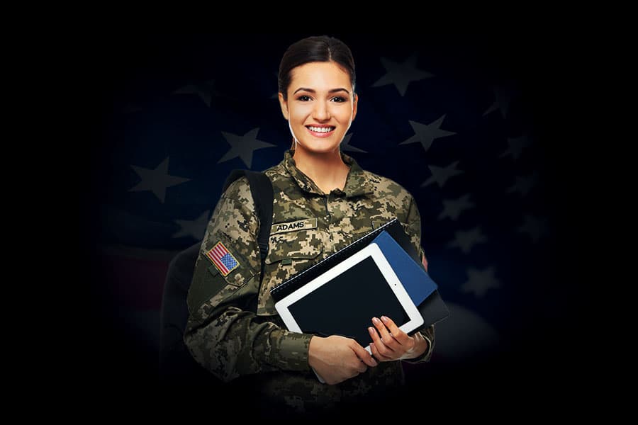 Photo of a smiling young soldier, holding textbooks and a backpack.